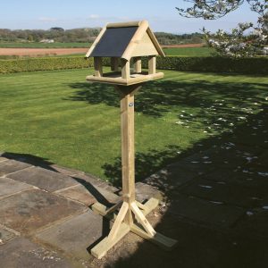 Wooden bird table with feeder